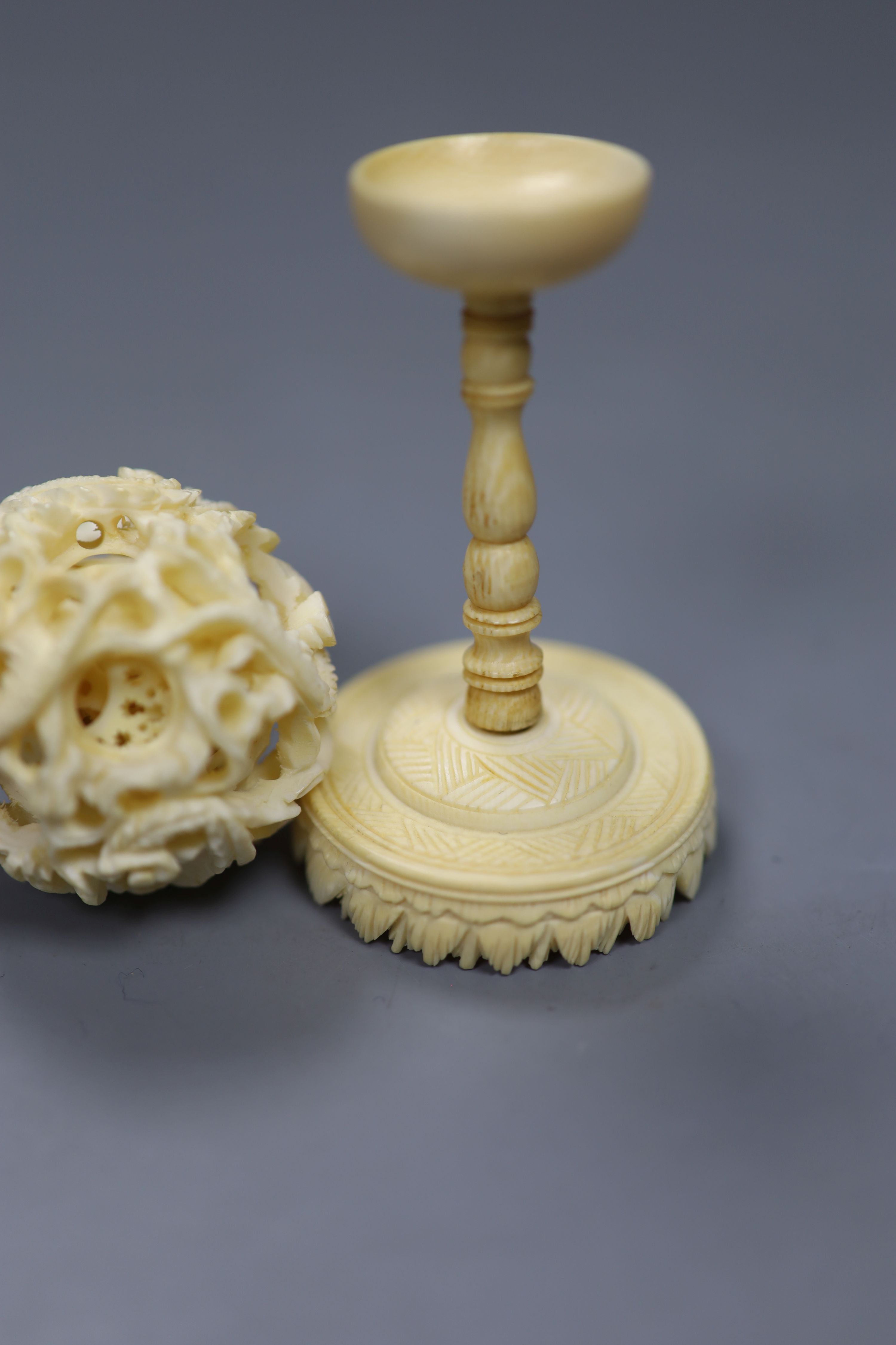 A carved Chinese ivory ball on stand, early 20th century, height 10.5cm